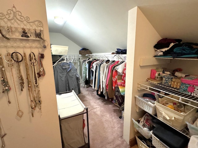 spacious closet with carpet flooring and lofted ceiling