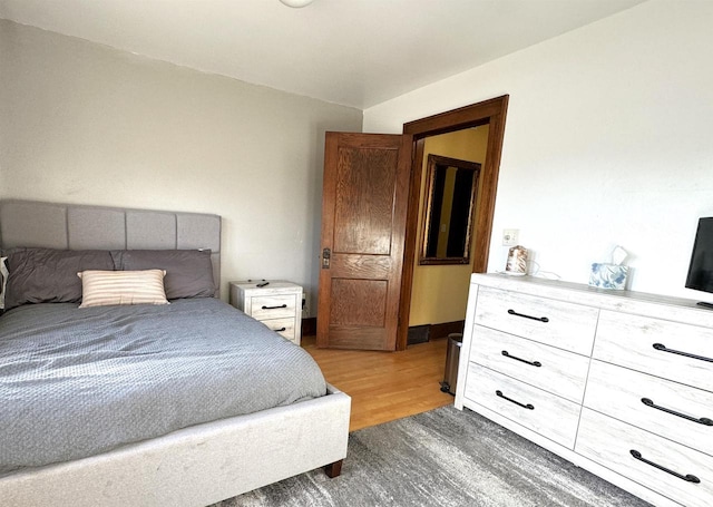 bedroom featuring dark hardwood / wood-style flooring