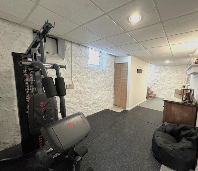 workout area featuring a drop ceiling