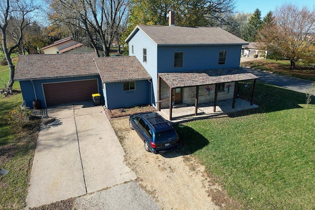 view of front facade featuring a front lawn and a garage