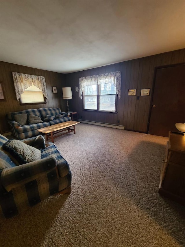 carpeted living room featuring a baseboard radiator and wood walls