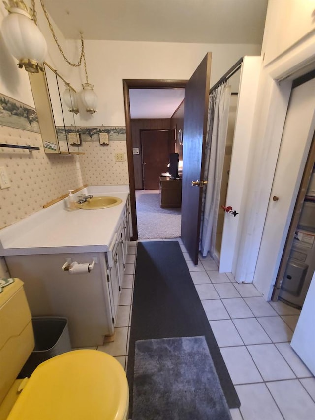 bathroom with vanity, walk in shower, and tile patterned floors