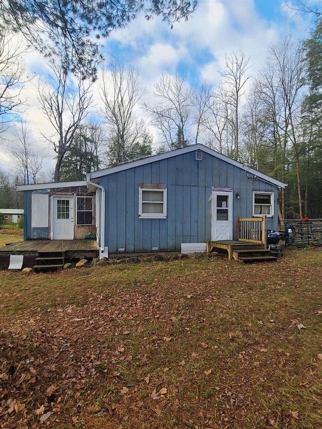 back of house with a yard