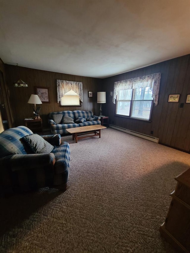 carpeted living room featuring baseboard heating and wood walls