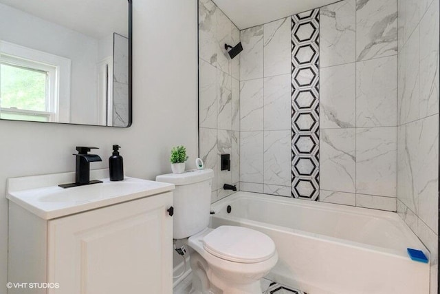 full bathroom with vanity, toilet, and tiled shower / bath