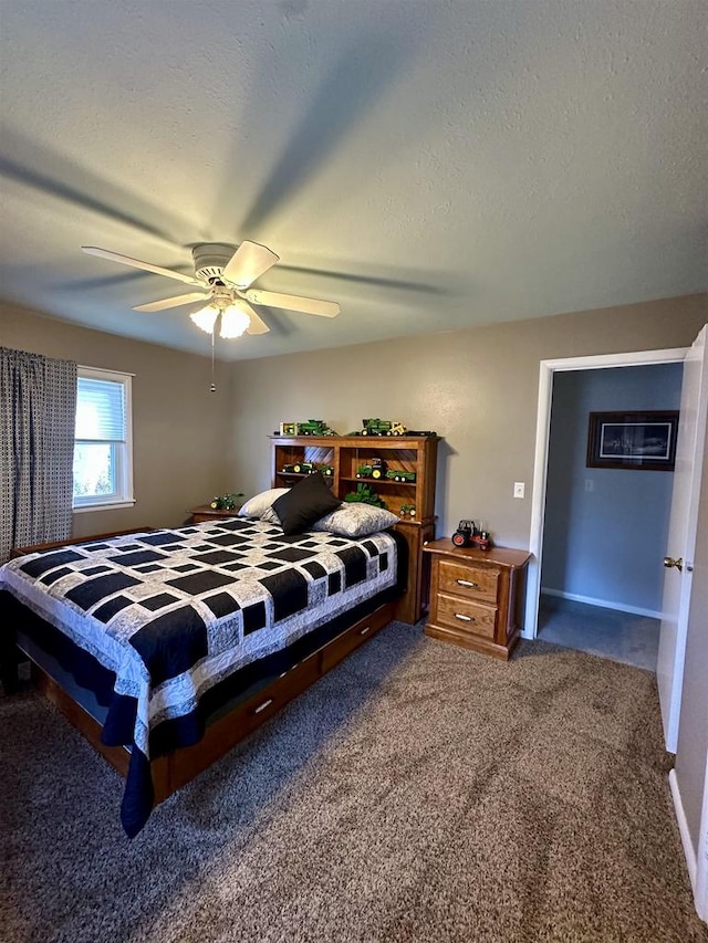 carpeted bedroom with ceiling fan and a textured ceiling