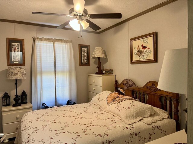 bedroom with a textured ceiling, ceiling fan, and crown molding