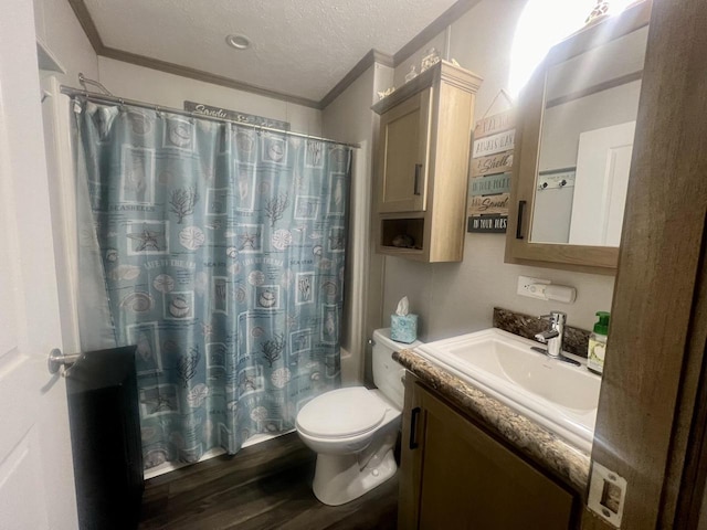 full bathroom featuring wood-type flooring, ornamental molding, vanity, a textured ceiling, and shower / bath combo