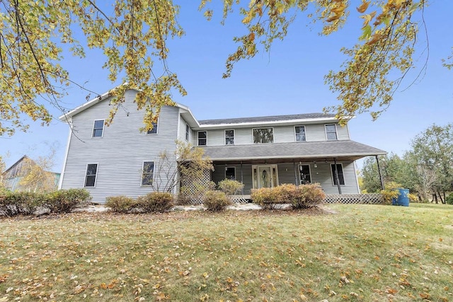 front of property featuring a porch and a front yard