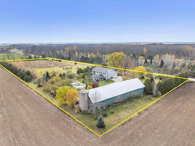 birds eye view of property with a rural view