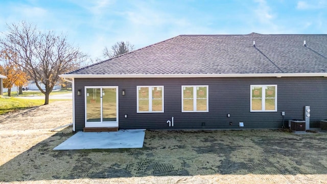 back of house featuring a patio area and cooling unit