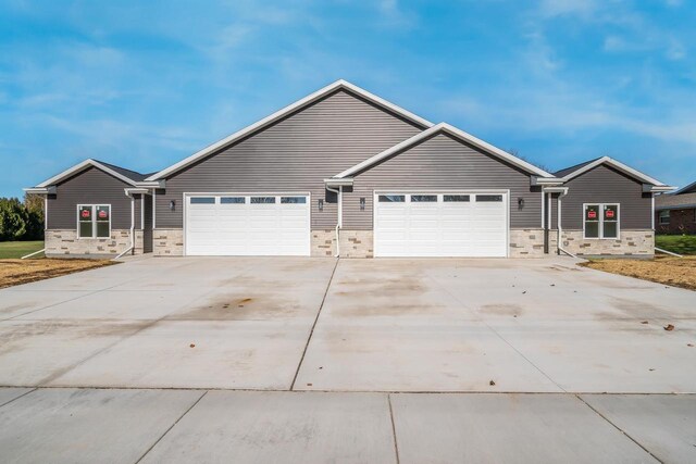 ranch-style home featuring a garage