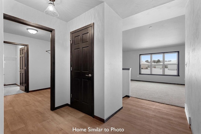 hallway featuring light hardwood / wood-style flooring