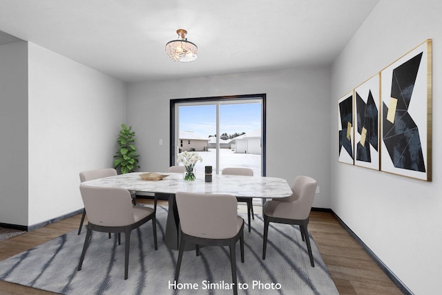 dining room with dark hardwood / wood-style flooring