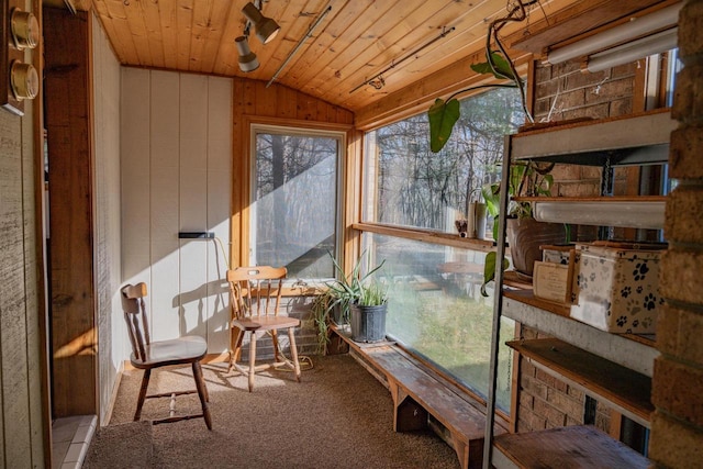 sunroom / solarium featuring wood ceiling and vaulted ceiling