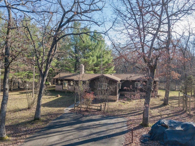 ranch-style home with a front lawn