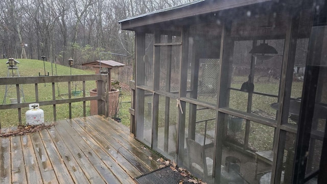 wooden deck featuring a yard