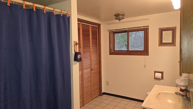 bathroom featuring tile patterned flooring and vanity