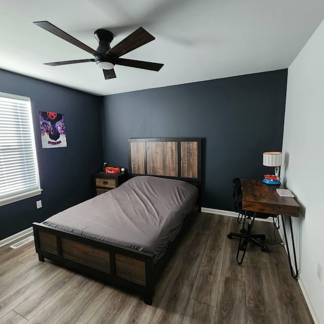 bedroom featuring hardwood / wood-style flooring and ceiling fan