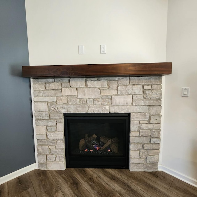 interior details with a fireplace and hardwood / wood-style floors