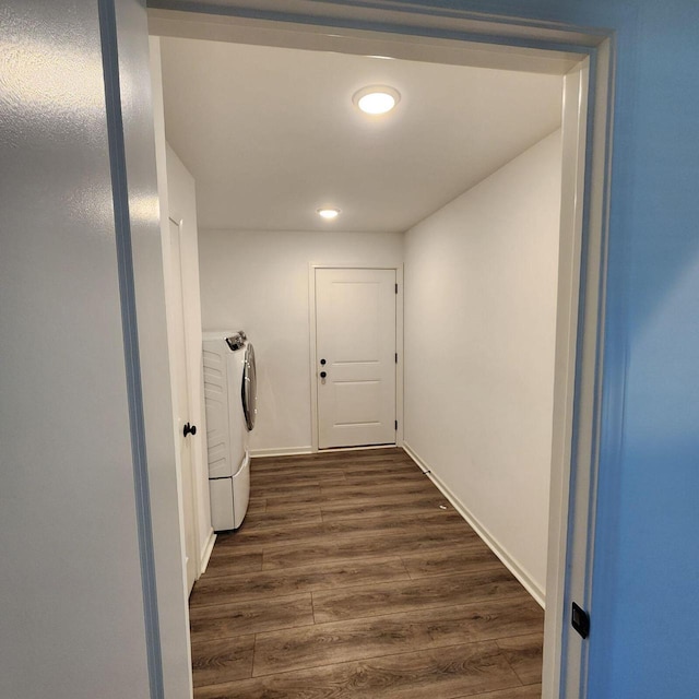 laundry area with dark hardwood / wood-style floors