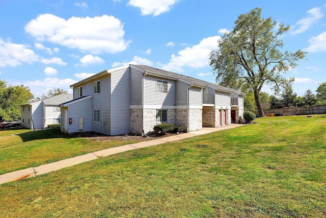 view of home's exterior with a lawn