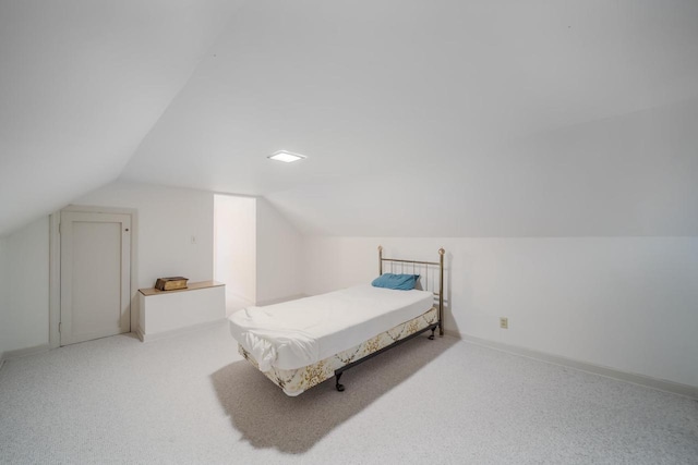 bedroom featuring billiards, light carpet, and vaulted ceiling