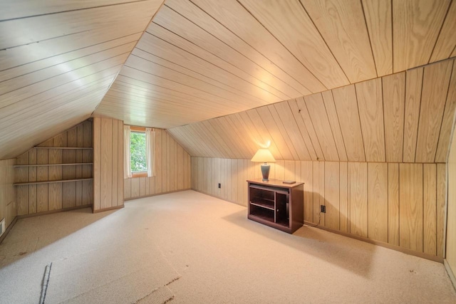 additional living space featuring light colored carpet, wood walls, lofted ceiling, and wood ceiling