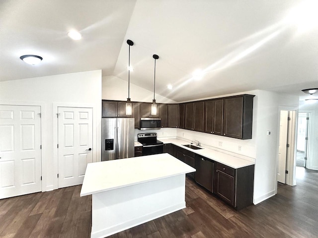 kitchen featuring stainless steel appliances, dark hardwood / wood-style flooring, hanging light fixtures, and vaulted ceiling