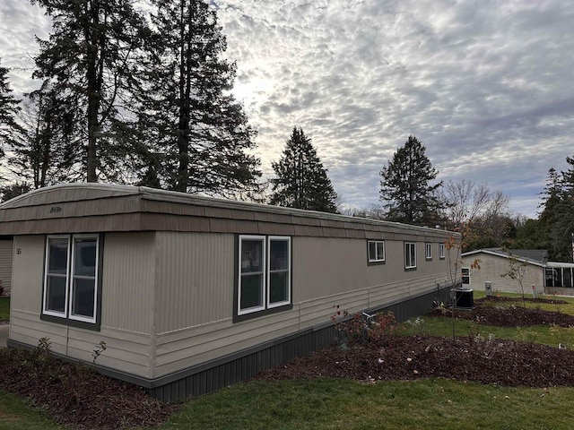 view of property exterior featuring central AC