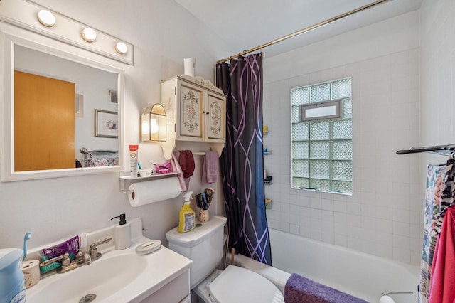 full bathroom featuring plenty of natural light, vanity, toilet, and shower / tub combo