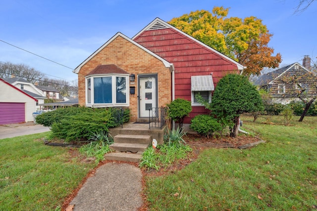 view of front of property featuring a garage and a front yard