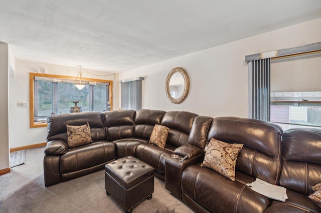 carpeted living room featuring plenty of natural light