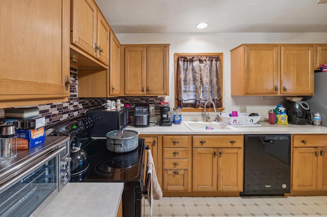 kitchen with black appliances, tasteful backsplash, and sink