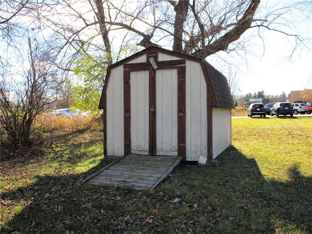 view of outbuilding with a lawn