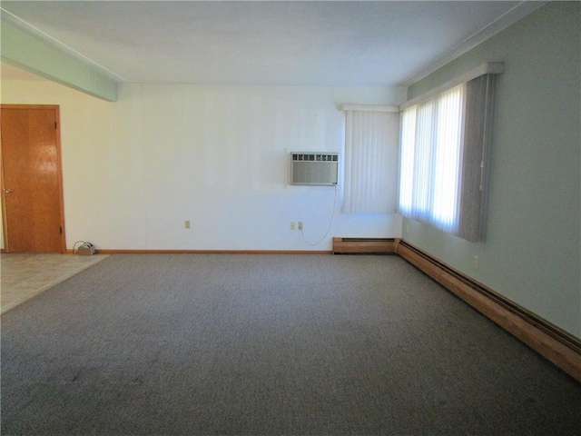 carpeted spare room featuring a baseboard heating unit and an AC wall unit