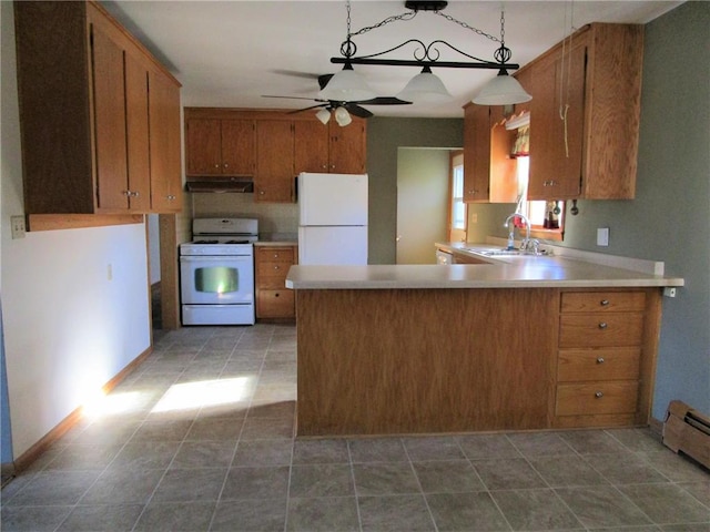 kitchen with kitchen peninsula, pendant lighting, sink, white appliances, and ceiling fan