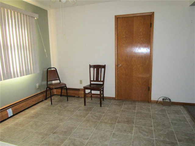 living area with ceiling fan