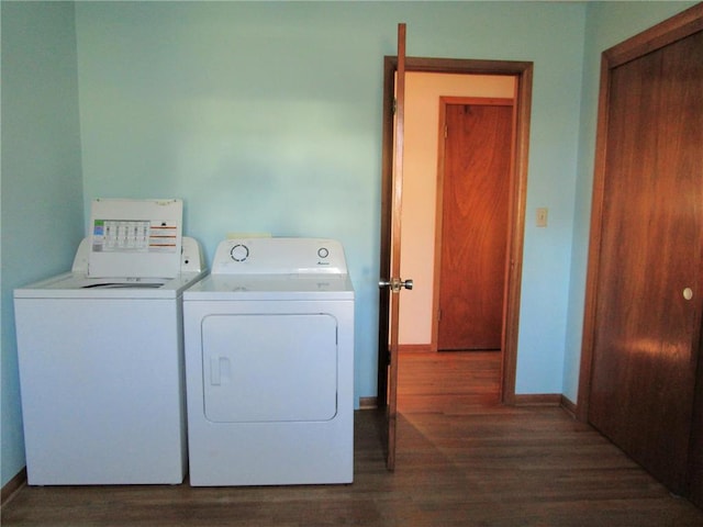 laundry area featuring dark hardwood / wood-style floors and independent washer and dryer