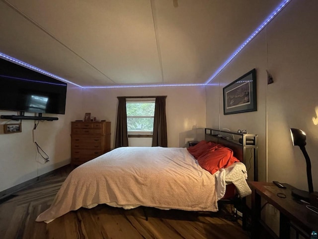 219 N 8th Ave W, Washburn, WI 54891 - bedroom featuring vaulted ceiling and wood finished floors