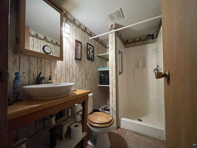 219 N 8th Ave W, Washburn, WI 54891 - bathroom featuring a sink, toilet, and a stall shower