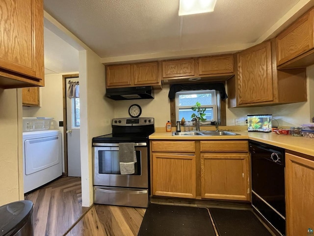 219 N 8th Ave W, Washburn, WI 54891 - kitchen with electric range, washer / clothes dryer, a sink, dishwasher, and under cabinet range hood