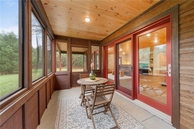 sunroom featuring wood ceiling