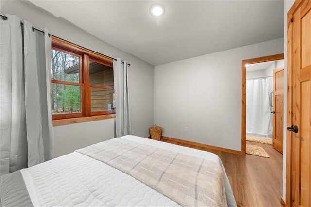 bedroom featuring light wood-type flooring