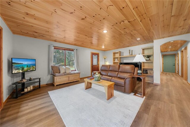 living room with wood ceiling and light hardwood / wood-style floors