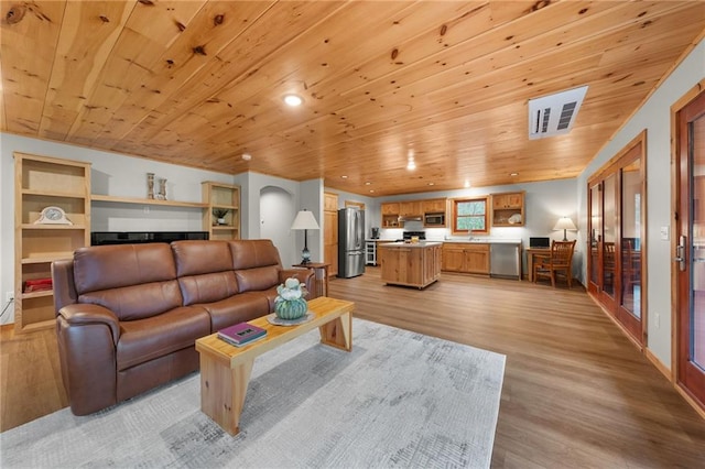 living room featuring light wood-type flooring and wood ceiling