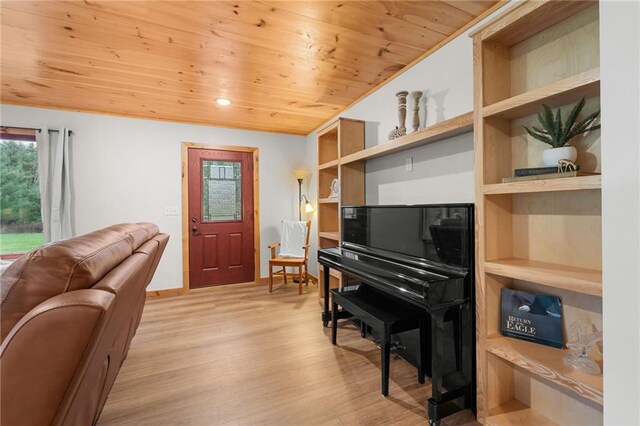 misc room featuring light hardwood / wood-style floors and wood ceiling