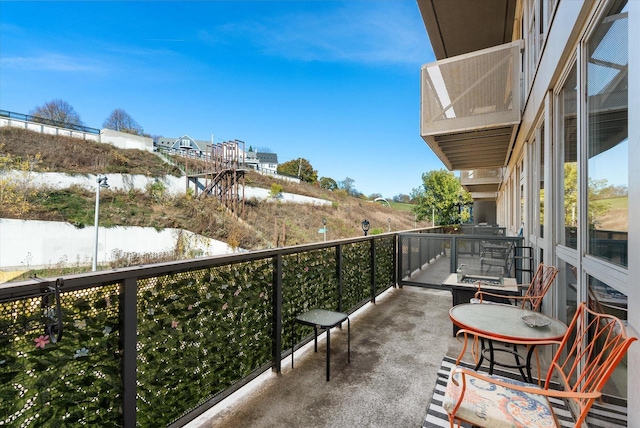 balcony featuring a water view