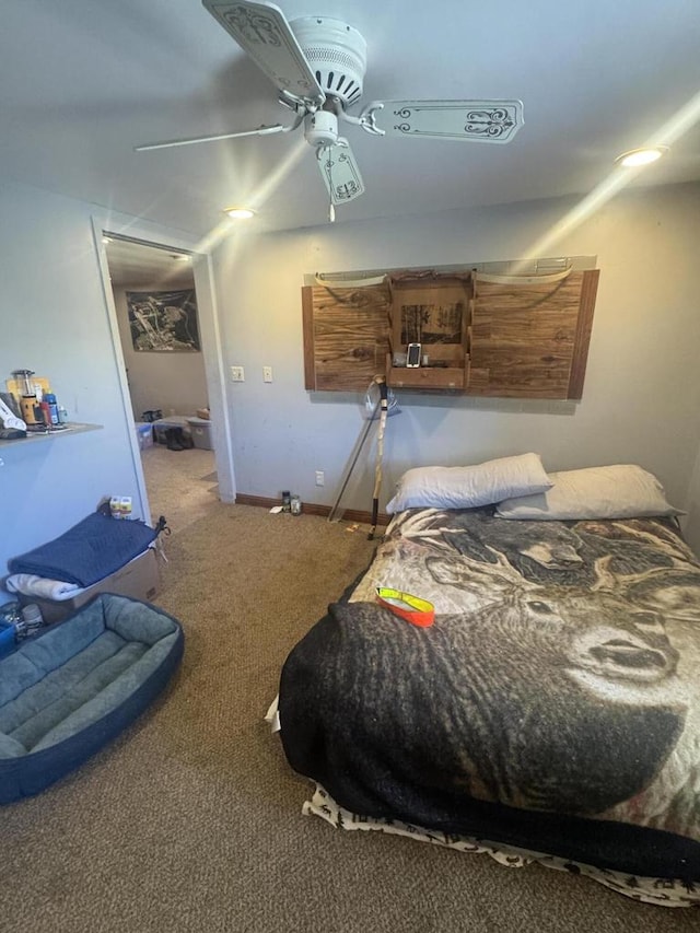 carpeted bedroom featuring ceiling fan