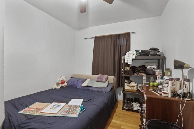 bedroom featuring light hardwood / wood-style floors and ceiling fan